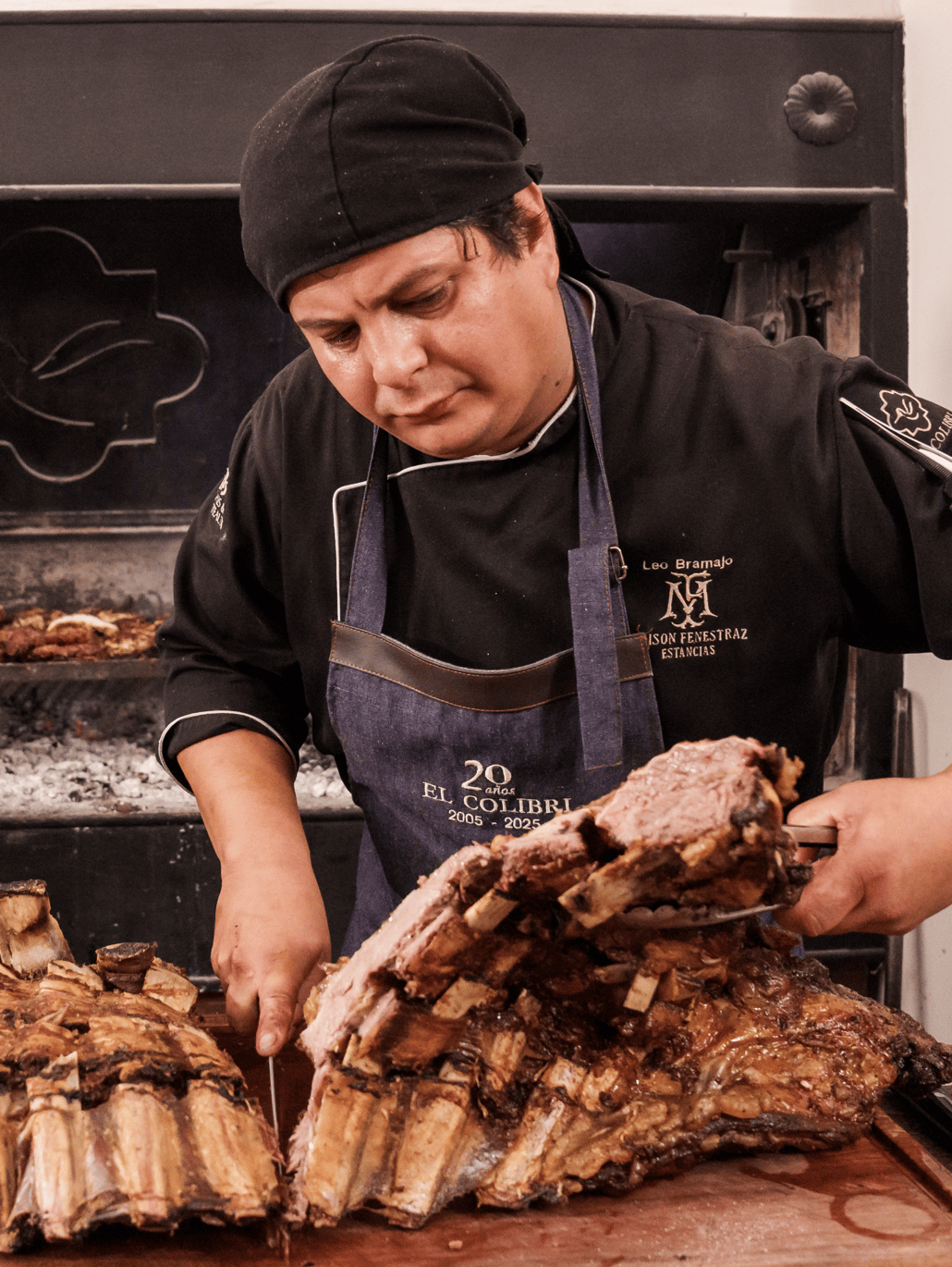 Chef preparing the traditional asado at Estancia El Colibrí